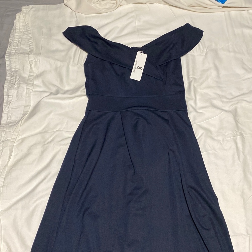 Medium dark blue off-shoulder cocktail dress with pockets.
